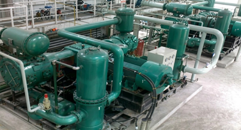 D series process gas compressor at chemical plant user site showing single-column horizontal installation with auxiliary systems