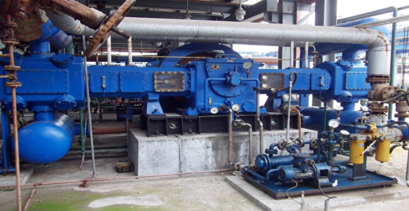 DW series gas compressor large installation at industrial plant showing multi-unit configuration for high-flow gas pipeline duty