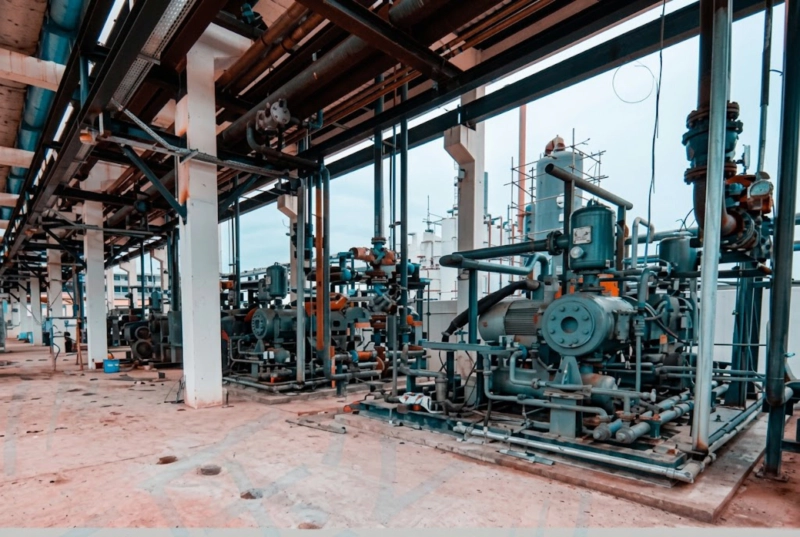 DW series refrigerant compressor at large cold storage or food processing plant installation showing industrial NH3 refrigeration system Russia